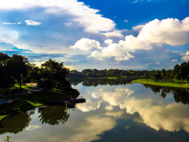 istock Blue sky reflected in big lake in public park 1153139282