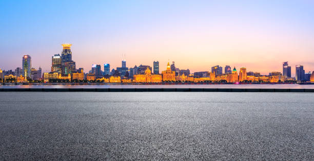 istock Shanghai city skyline and asphalt highway at sunset 1153143582