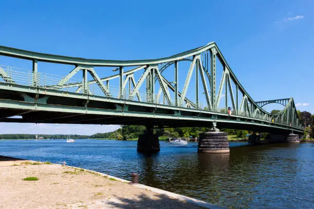 Famous bridge for prisoner exchange during the Cold War, heading out toward Berlin city over narrow point of Glienicker Lake