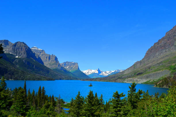 istock Lake with Snow covered mountain in backdrop 1153148812