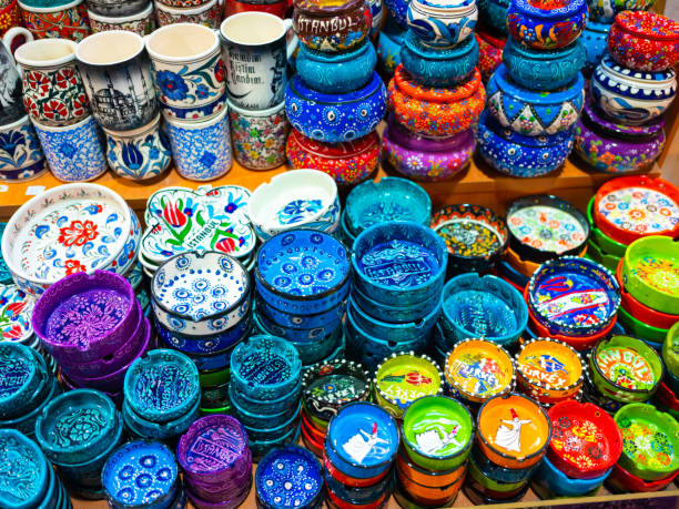 Painted beautiful dishes on the counter. Plates with patterns.