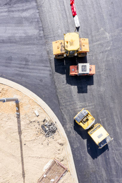 istock road rollers paving asphalt road. road construction, top view 1153153625