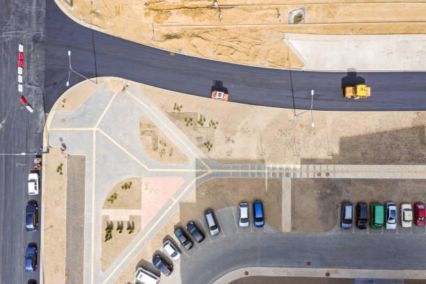 istock heavy machines working on the road construction site. aerial top view 1153153647
