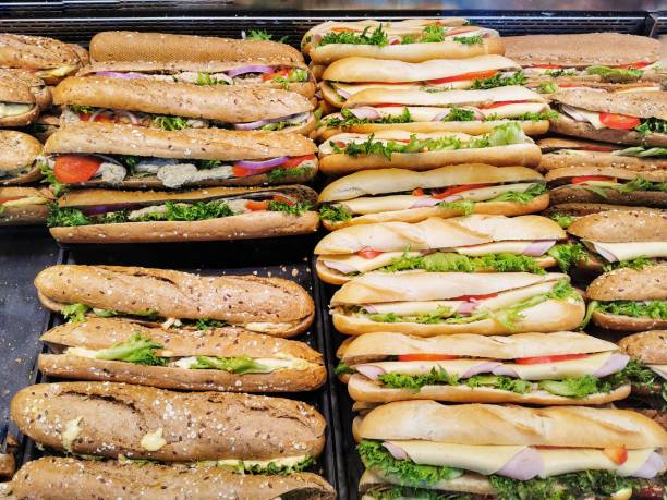 istock Bread sandwich with ham in a market 1153154037