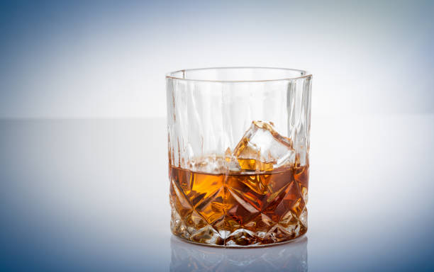 istock Glass of scotch whiskey and ice 1153159948
