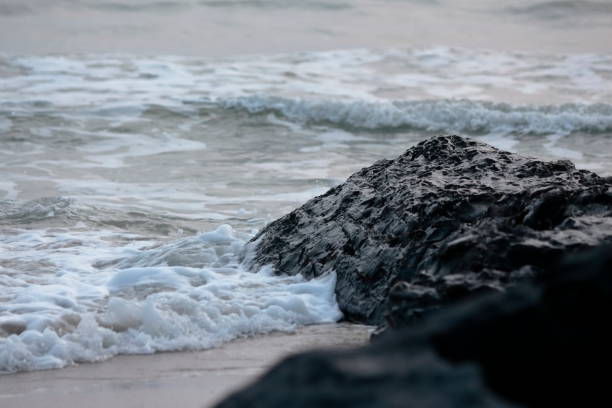 istock Ocean waves and rocks by the sea 1153163203