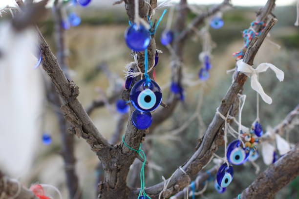 istock Nazar amulets and Decorative jugs on a tree. Cappadocia, Turkey. 1153163240