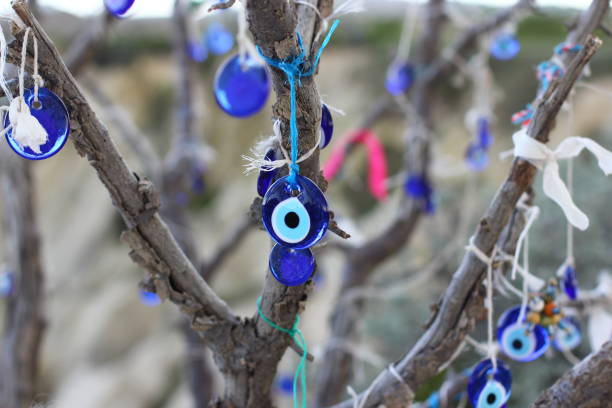 istock Nazar amulets and Decorative jugs on a tree. Cappadocia, Turkey. 1153163246