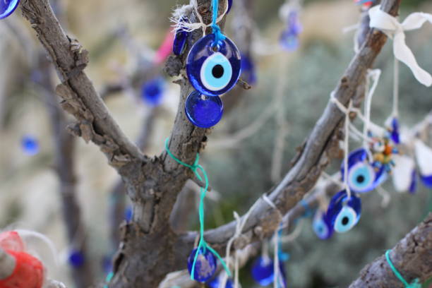 istock Nazar amulets and Decorative jugs on a tree. Cappadocia, Turkey. 1153163258