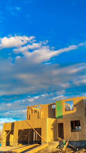 istock Vertical frame Framework of a house under construction viewed on a bright sunny day 1153164725