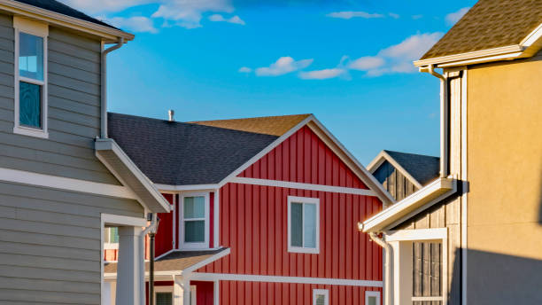 istock Panorama Dry cracked ground between houses lit by sunlight on a sunny day 1153164733