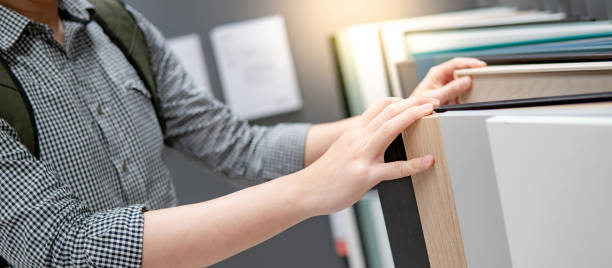 istock Male hand choosing cabinet or countertop materials 1153169421