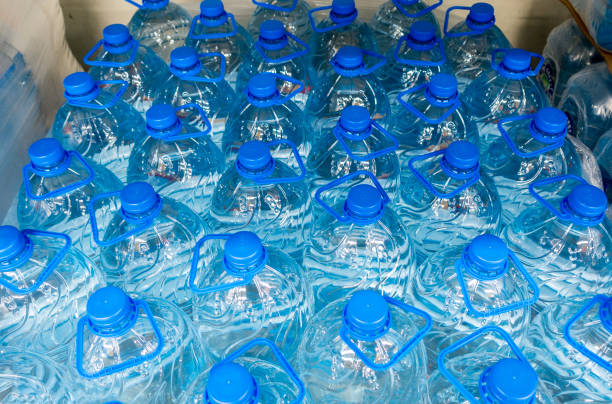 istock Lid plastic water bottle in the market. multi-colored plastic bottle caps 1153172617