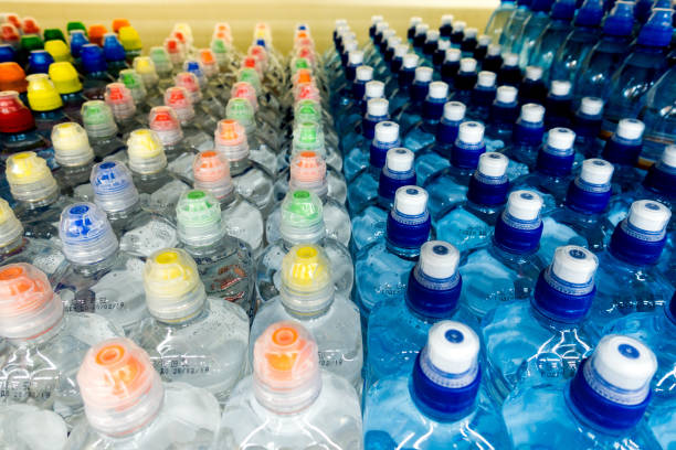 istock Lid plastic water bottle in the market. multi-colored plastic bottle caps 1153172643