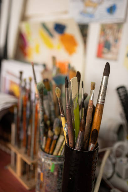 istock Close up of different brushes for painting standing on the table 1153173755