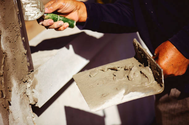 istock Workers are using a trowel to decorate the cement pillars into a beautiful ridge. 1153177607