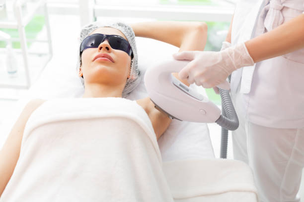 istock Nice pleasant pretty woman doing underarm epilation 1153179609