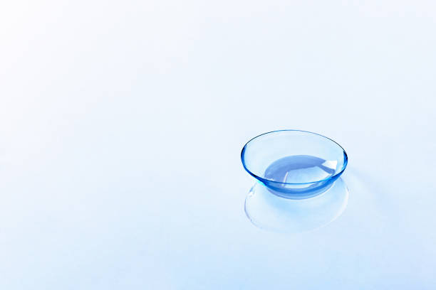 istock Contact lens on light blue background 1153193489