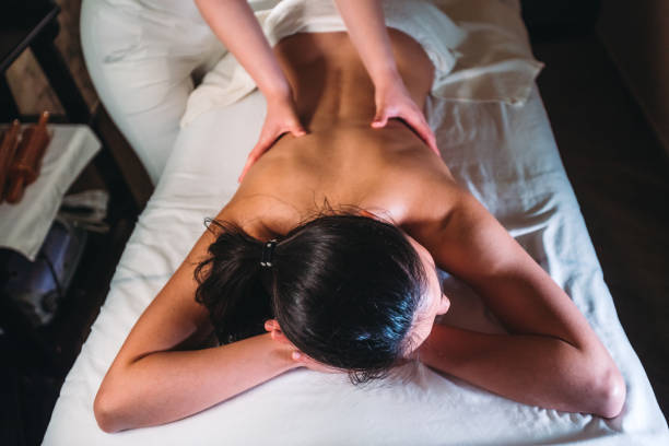 istock Young woman having back massage at the spa 1153194741