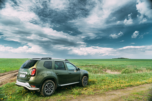 Gomel, Belarus - May 11, 2019: Renault Duster Suv In Spring Field Countryside Landscape. Duster Produced Jointly By French Manufacturer Renault And Its Romanian Subsidiary Dacia.