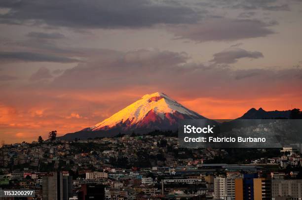 Sunrise In Quito City With Cotopaxi Volcano In The Background Stock Photo - Download Image Now