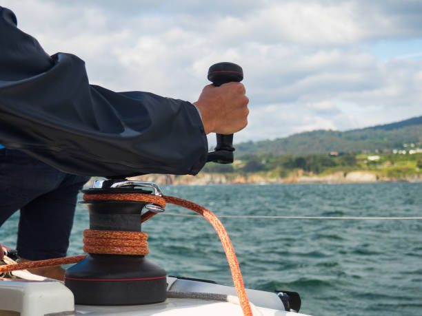 istock Woman with sailboat winch 1153202544