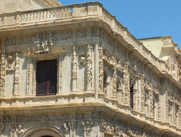 The stunning details which wrap around the town hall in Seville have many intricate carvings and cornices
