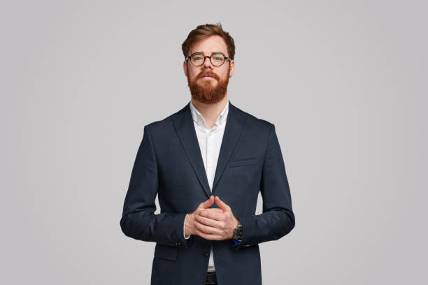 istock Executive man in trendy suit looking at camera 1153206644