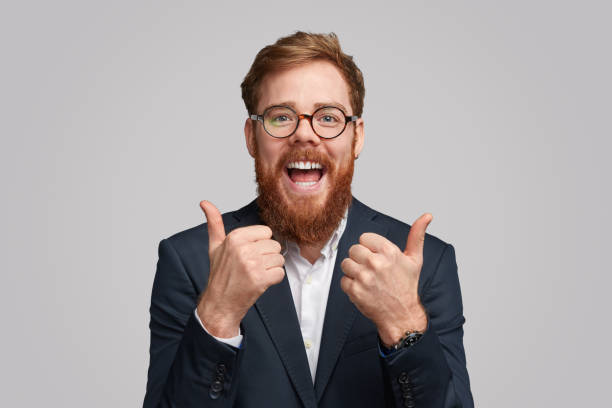 istock Thrilled cool businessman showing thumbs up 1153206653