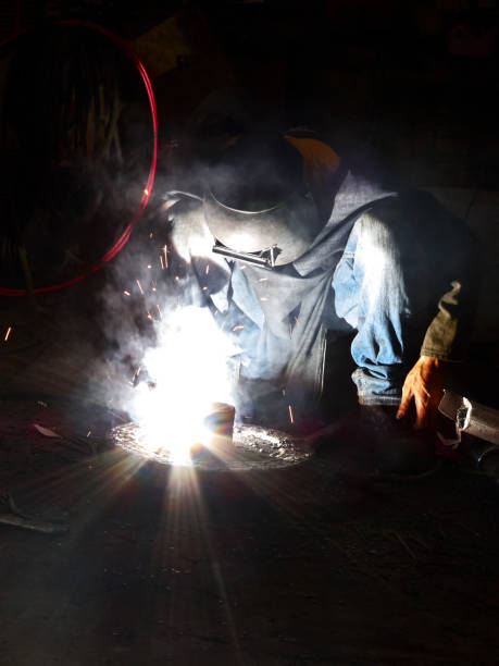 istock Welder in Asia working with little protective gear 1153206817