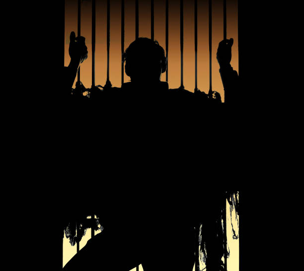 Men behind prison bars stock photo