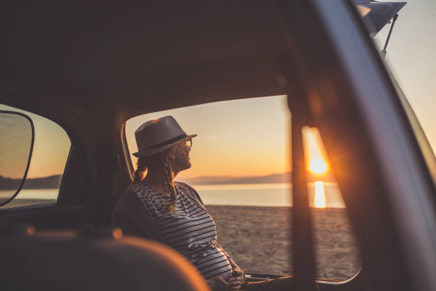 istock Watching the sunset on the beach 1153207792