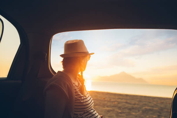 istock Watching the sunset on the beach 1153208001