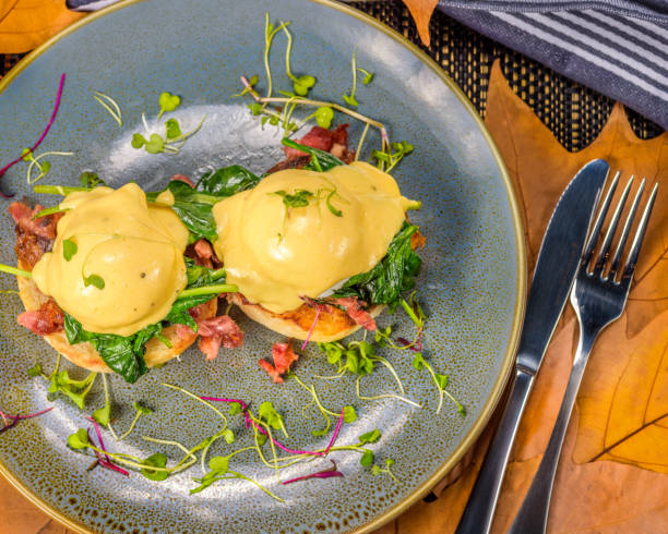 istock A serving of two Eggs Benedict, with a muffin base, ham, poached Eggs and hollandaise sauce 1153208131