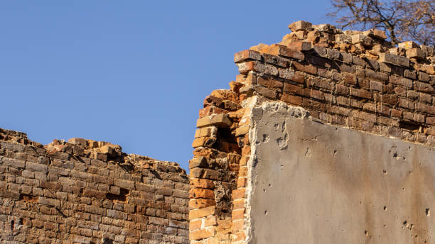 istock Fragment of old destroyed ancient brick wall 1153208186