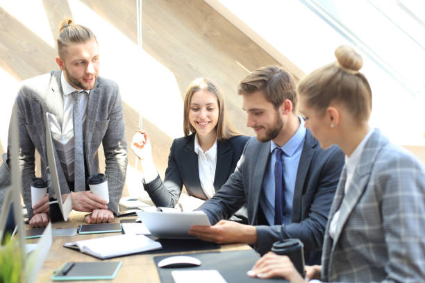 istock Business partners discussing documents and ideas at meeting. 1153209119