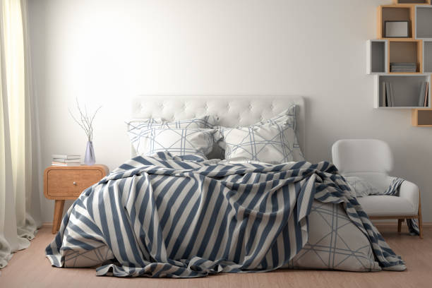 istock Bedroom  interior with bed with duvet, bedding and pillows 1153209251