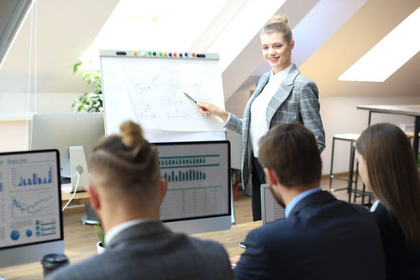 istock business conference presentation with team training flipchart office. 1153210387
