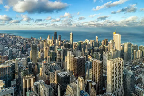 Photo of Aerial view of Chicago skyline panorama with blue sky and cloud at beautiful sunset time in Chicago, Illinois, United States, Landscape and Modern Architecture concept