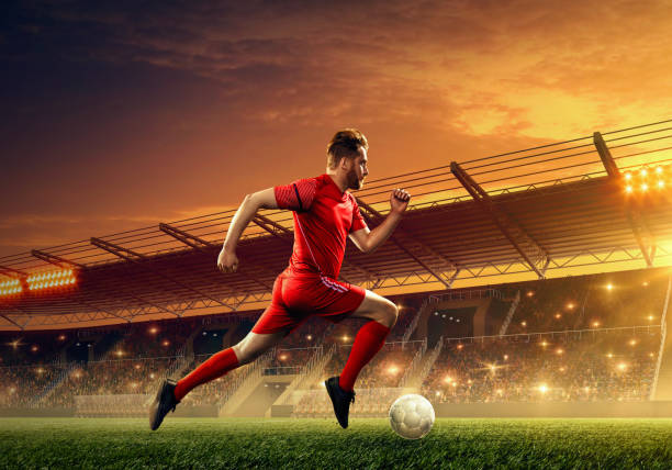 istock Soccer player in action on professional soccer stadium. 1153212607