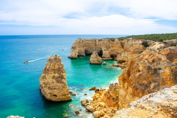 View from above on Praia de Marinha or Benagil, Most beautiful beach in Algarve, Portugal View from above on Praia de Marinha or Benagil, Most beautiful beach in Algarve, Portugal benagil photos stock pictures, royalty-free photos & images