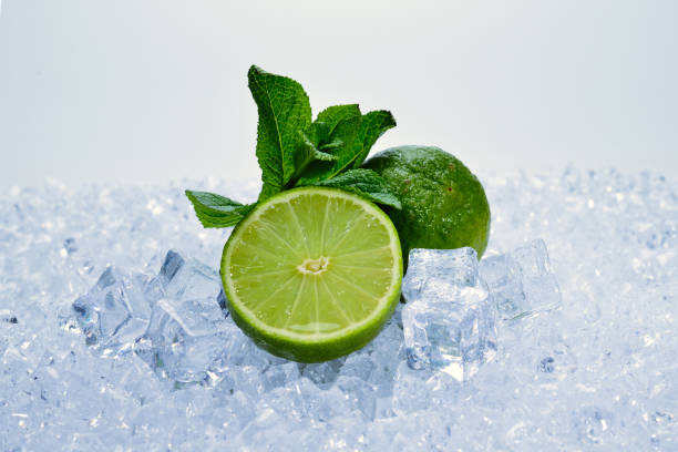istock Juicy fresh lime and mint on ice cubes. 1153212732
