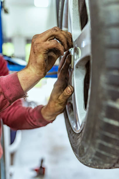 istock Tire repairer changing the car tire 1153212742