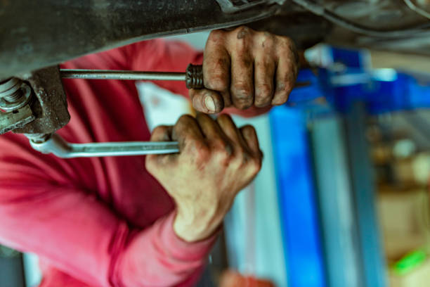istock Mechanic at work in his garage 1153214124