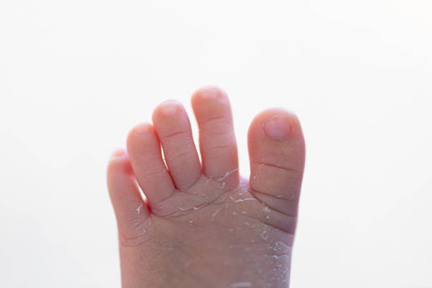 Baby feet in bath. newborn baby skin care.