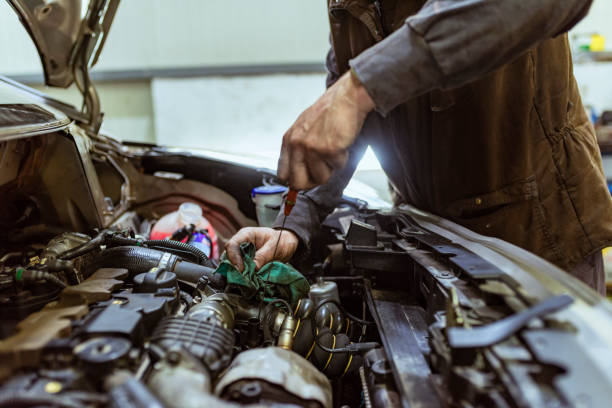 istock Car mechanic repair an engine. 1153215875