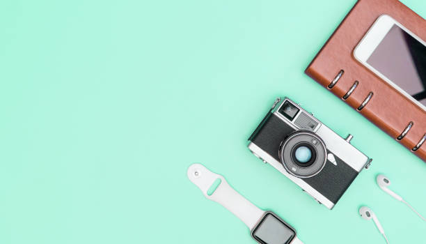 istock camera with smart watch earphone on blue teal gadget set 1153216705