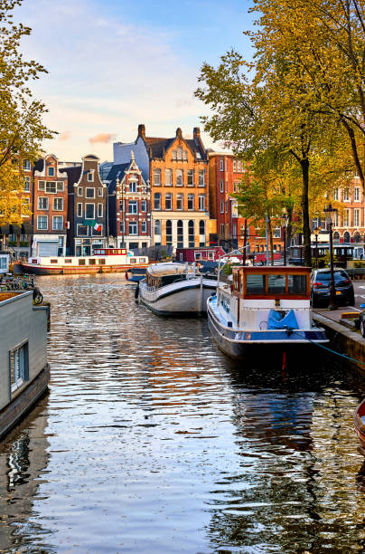 istock Amsterdam Netherlands dancing houses over river Amstel. 1153217153