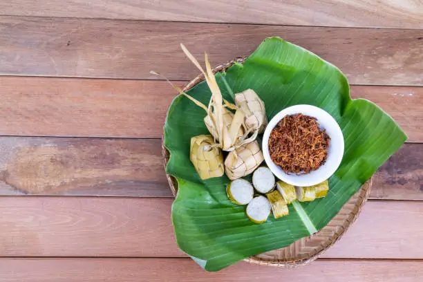 Photo of Ketupat, lemang, served with serunding, popular Malay delicacies during Hari Raya celebration