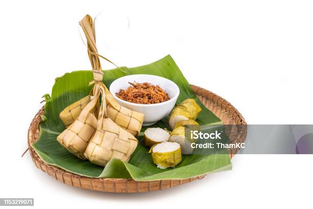 Ketupat Lemang Served With Serunding Popular Malay Delicacies During Hari Raya Celebration Stock Photo - Download Image Now